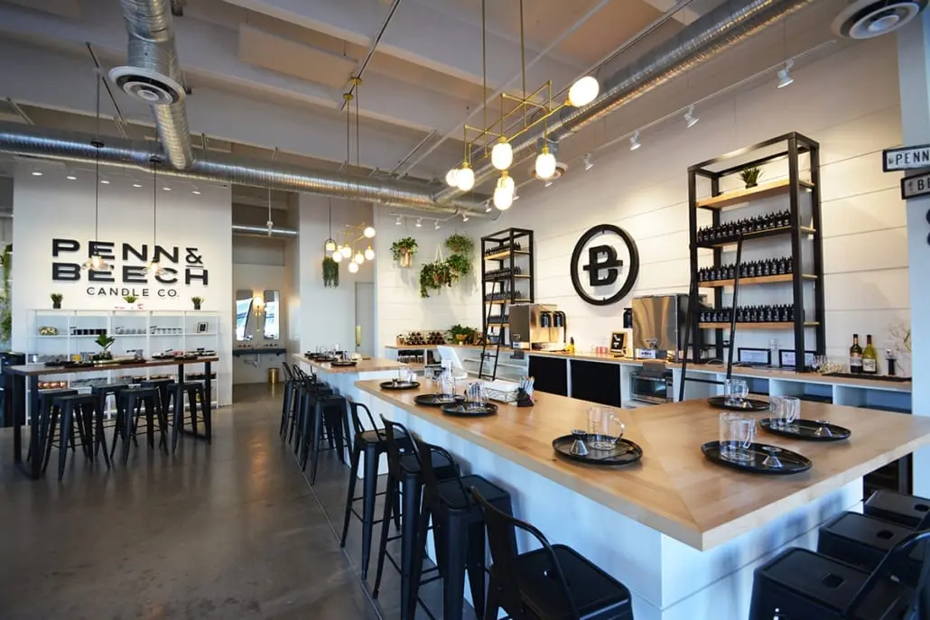 Experiential retail space in Carmel, Indiana with workshop tables, seating, and interactive layout