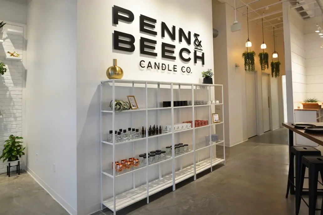 Retail display wall in Carmel, Indiana with branded signage, shelving, and product merchandising