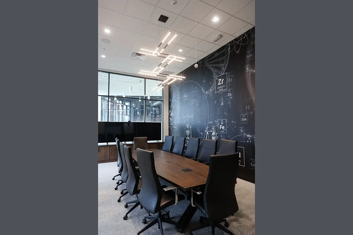 Conference room in Fishers Indiana with large meeting table and custom graphic feature wall