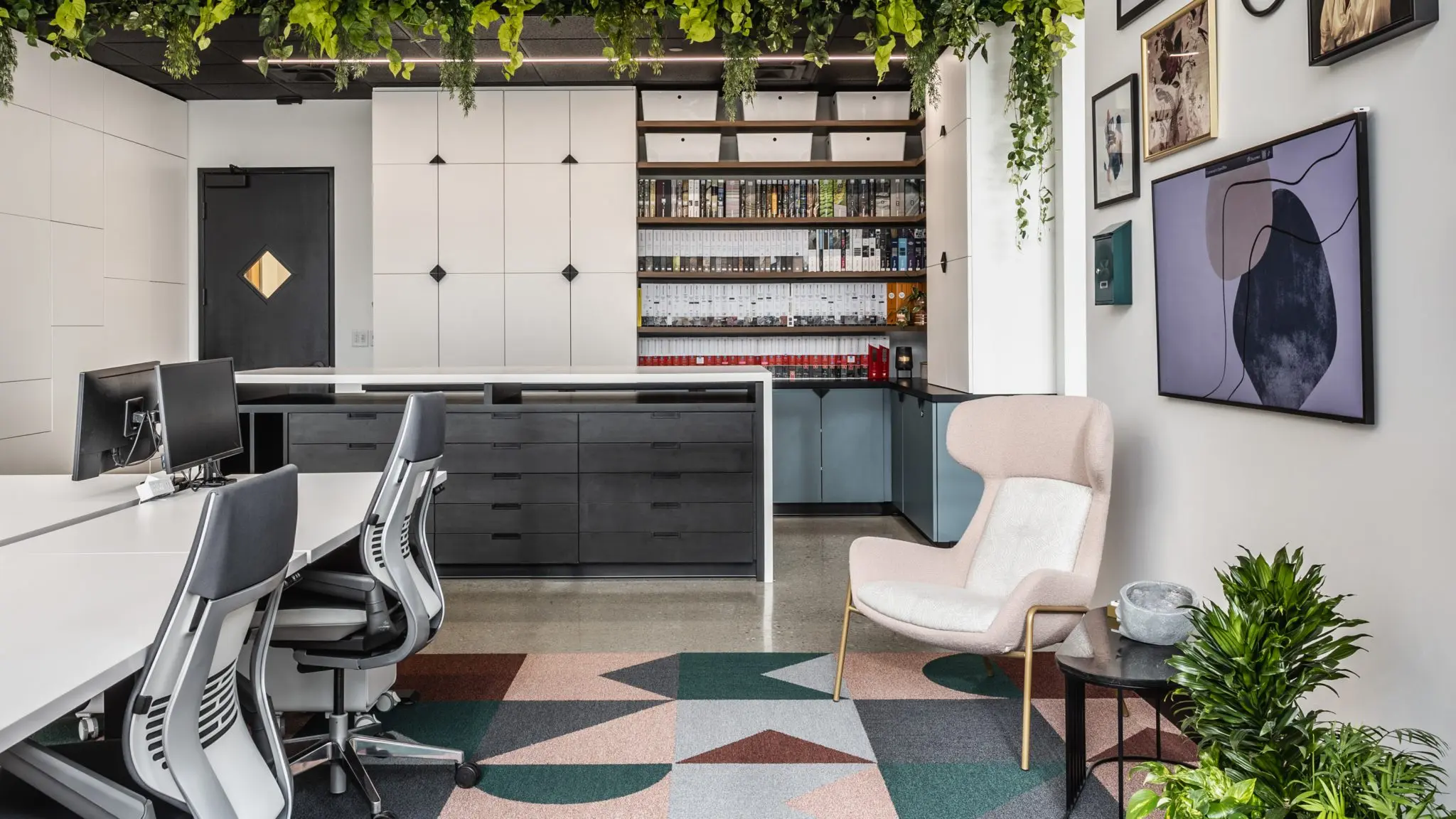 Office resource library and workspace in Indianapolis with material samples, storage, and collaborative desks