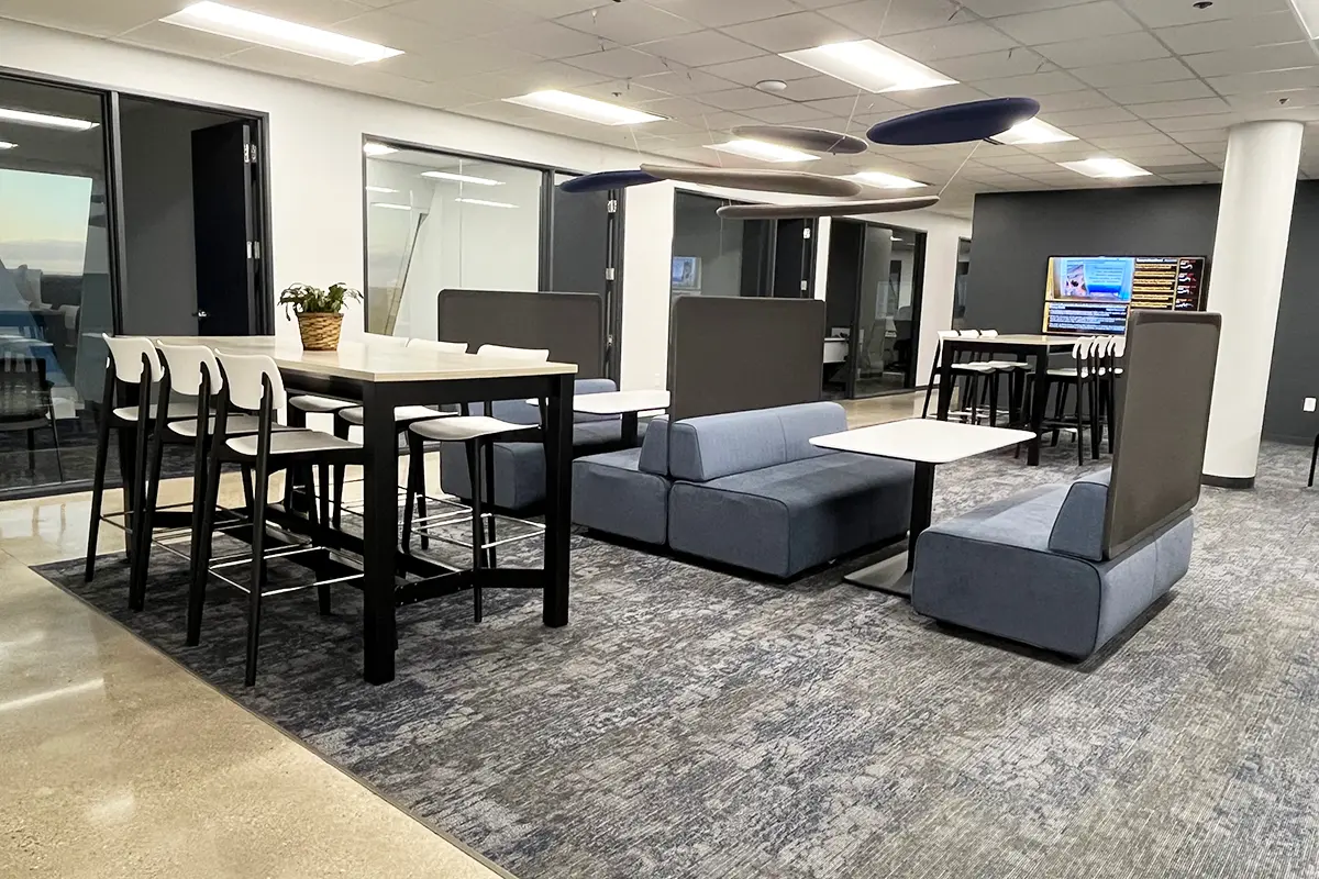 Collaborative office space with high top tables, booth seating, and lounge areas in Indianapolis