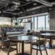 Office café in Fishers, Indiana with dining tables, booth seating, and open kitchen layout