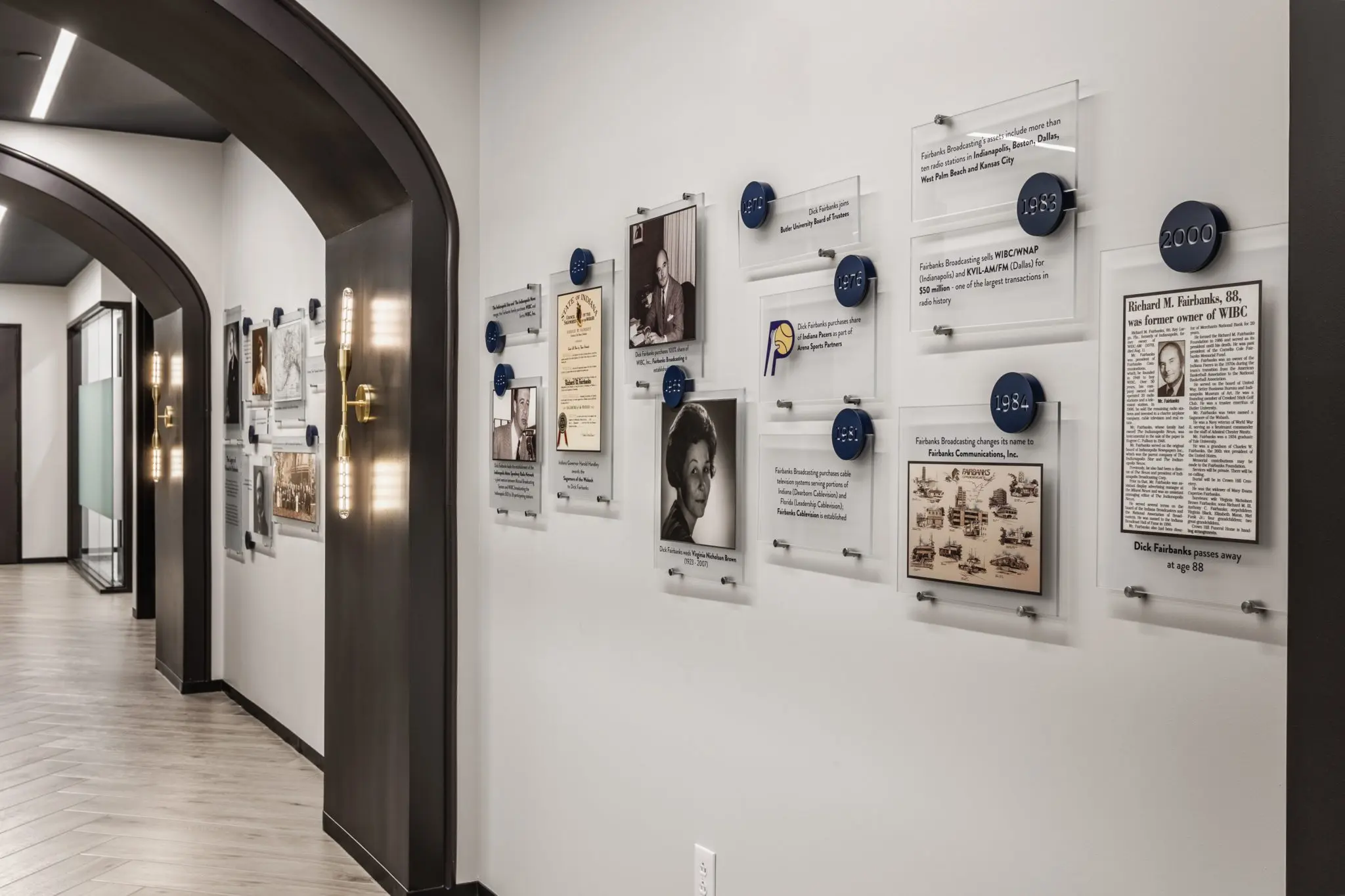 Office feature wall in central Indiana showcasing company history with mounted graphics and timeline displays