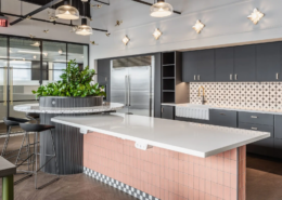 Office kitchen in Fishers, Indiana with large island, tile backsplash, and modern cabinetry