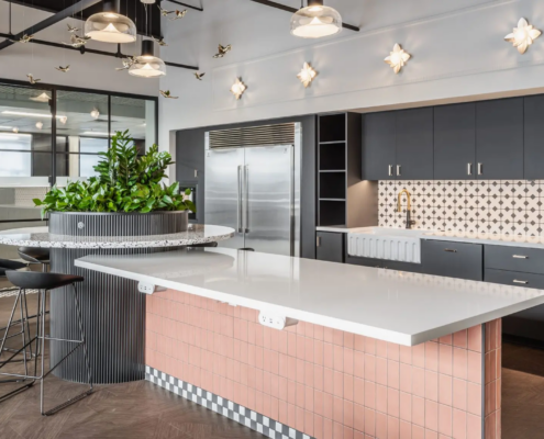Office kitchen in Fishers, Indiana with large island, tile backsplash, and modern cabinetry