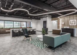 Modern office lobby in Indianapolis with reception desk, lounge seating, and feature lighting
