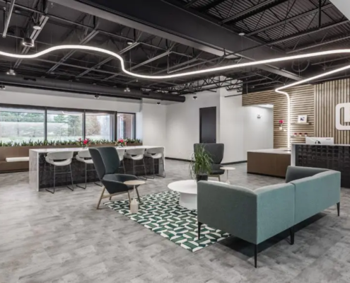 Modern office lobby in Indianapolis with reception desk, lounge seating, and feature lighting