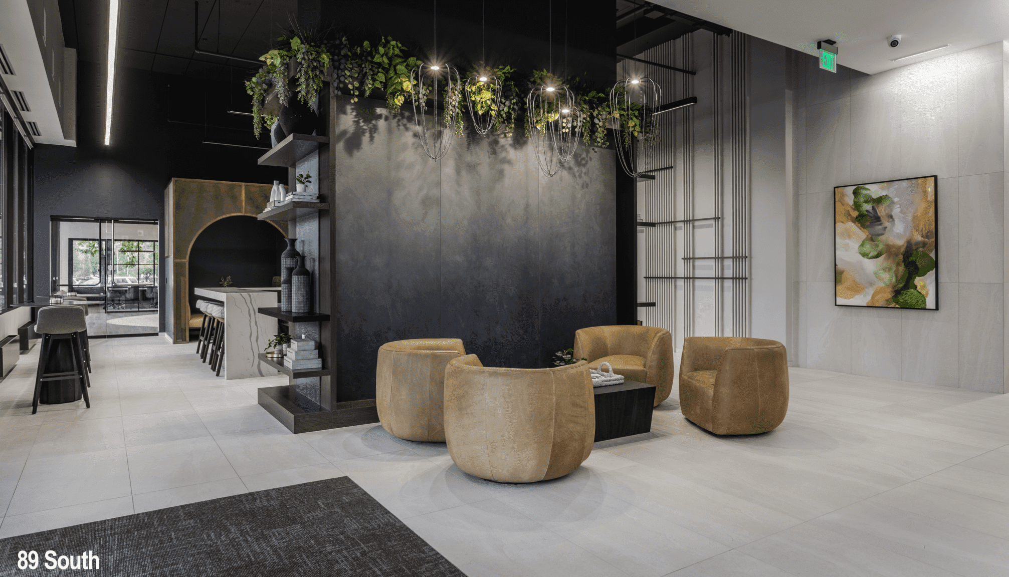 Commercial office building lobby in Indianapolis with soft seating, greenery, and modern shelving