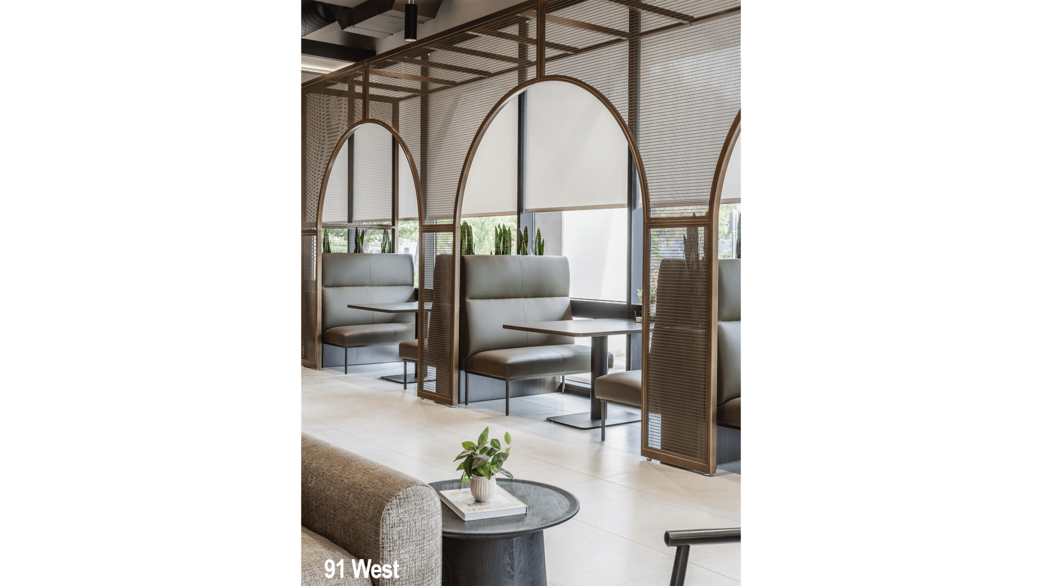 Restaurant booth seating design in Indianapolis, Indiana with arched dividers and modern hospitality layout