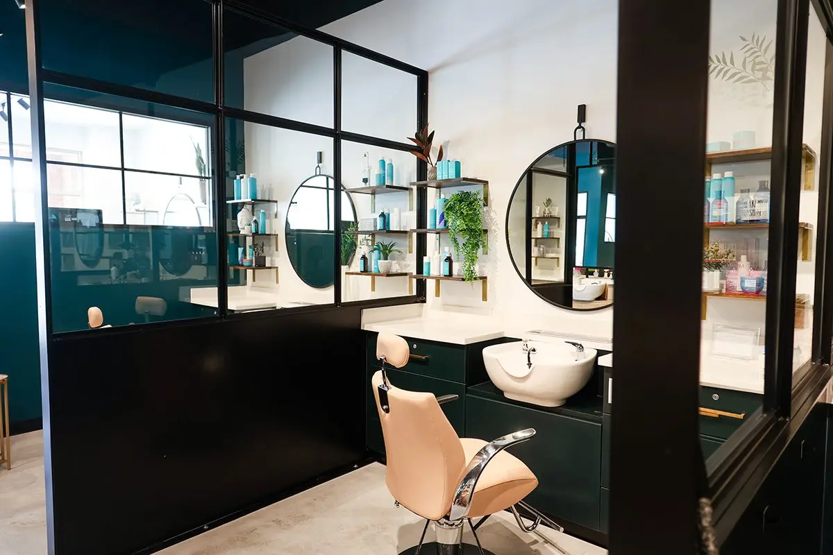 Salon interior design in northern Indiana with styling stations, mirrors, and modern workspace layout